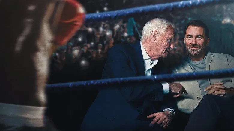 Barry Hearn in a sharp suit, mid-gesture, his face a mix of amusement and calculation