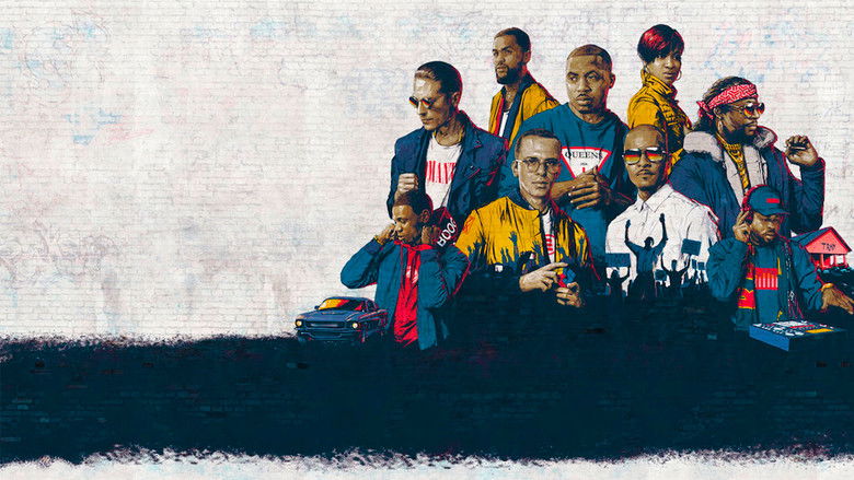 A dimly lit studio, T.I. standing in front of a microphone, his expression unreadable but heavy.