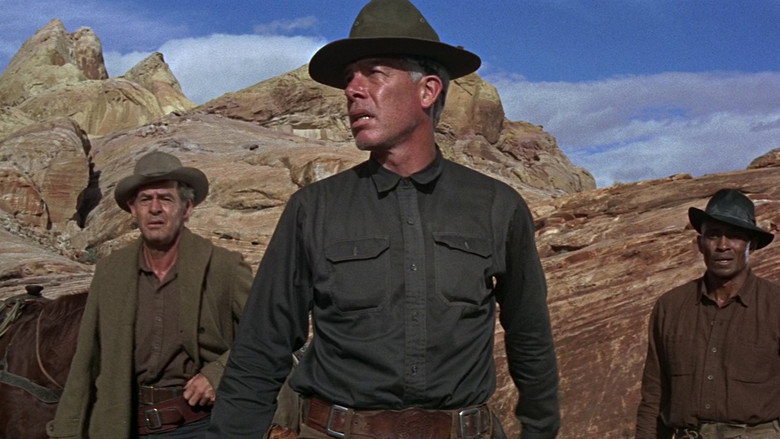 Jack Palance looking out across the desert with a resigned expression
