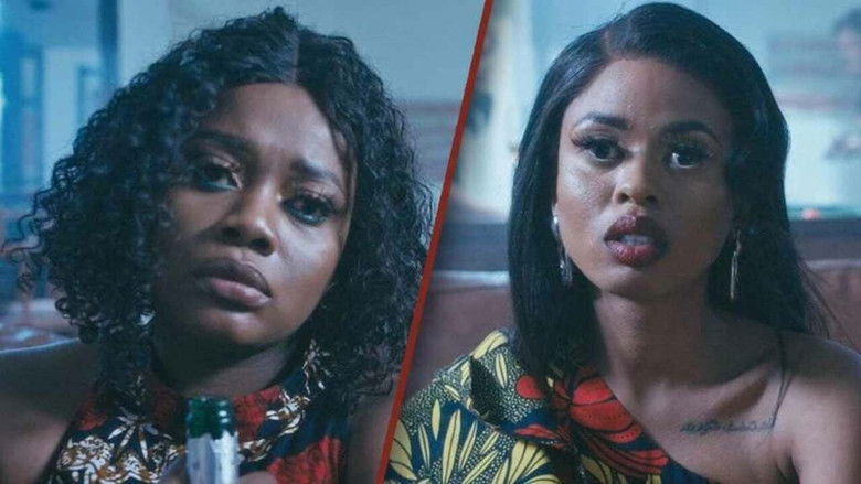 Two sisters stand in a dimly lit mansion, their faces half-lit by the glow of a chandelier, one looking determined, the other nervous.