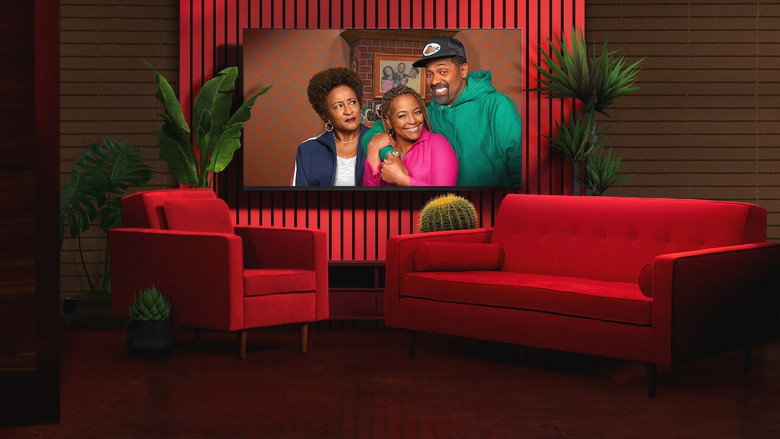 The cast of *The Upshaws* gathered around a table, laughing and leaning into the camera, as if caught in the middle of an inside joke.
