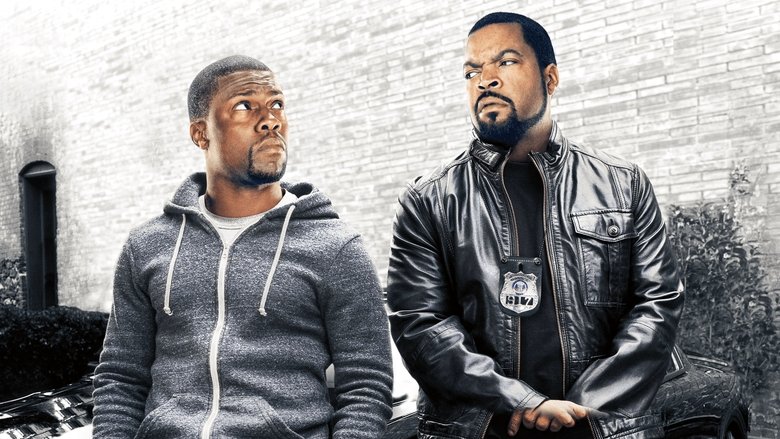 Kevin Hart and Ice Cube in the police cruiser, Hart mid-rant, Cube looking unimpressed