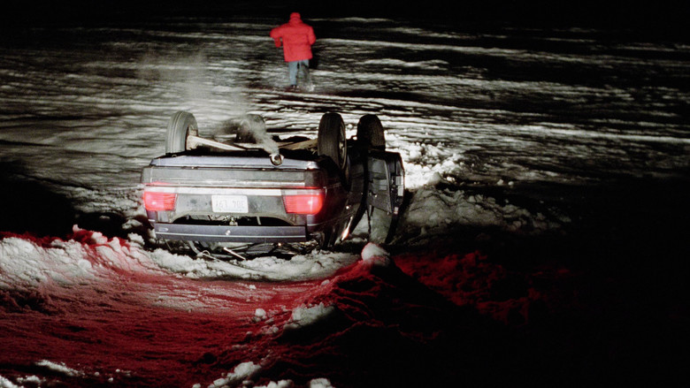 Carl Showalter and Gaear Grimsrud inside a car, looking tense in the cold light