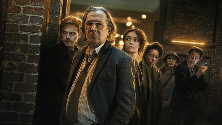 Slough House team members standing in a dimly lit, cluttered office