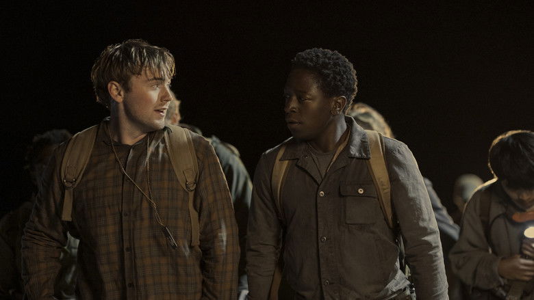 The military overseers watching the teenagers from a vehicle