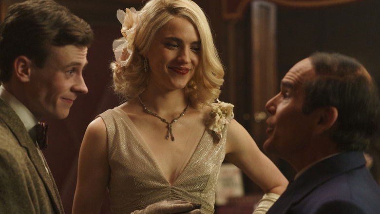 Margaret Qualley sitting at a table