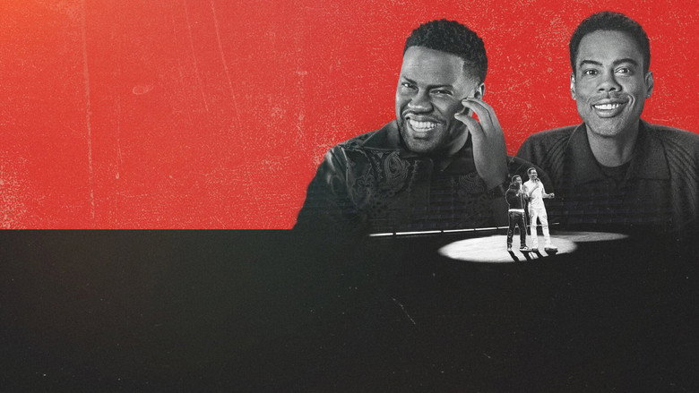 Kevin Hart and Chris Rock mid-conversation, seated in a dimly lit, intimate setting