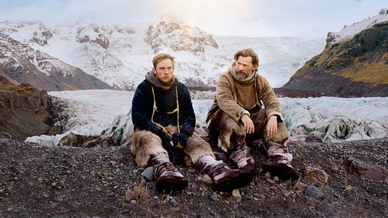 Two explorers standing in the vast, empty white landscape of Greenland