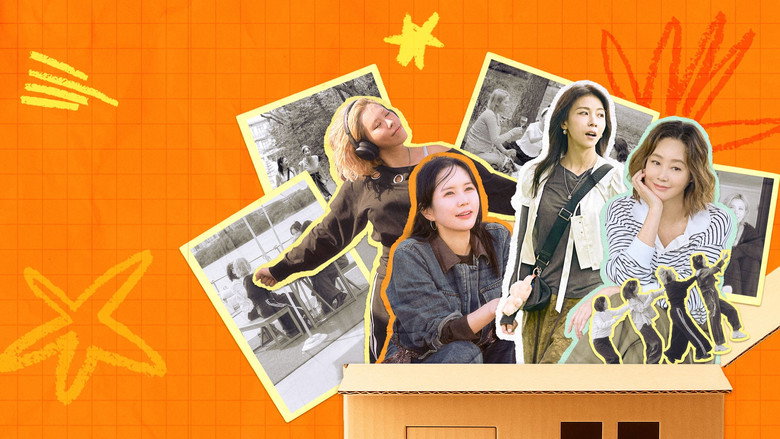 A crane lowering a wooden cabin into a lush green forest