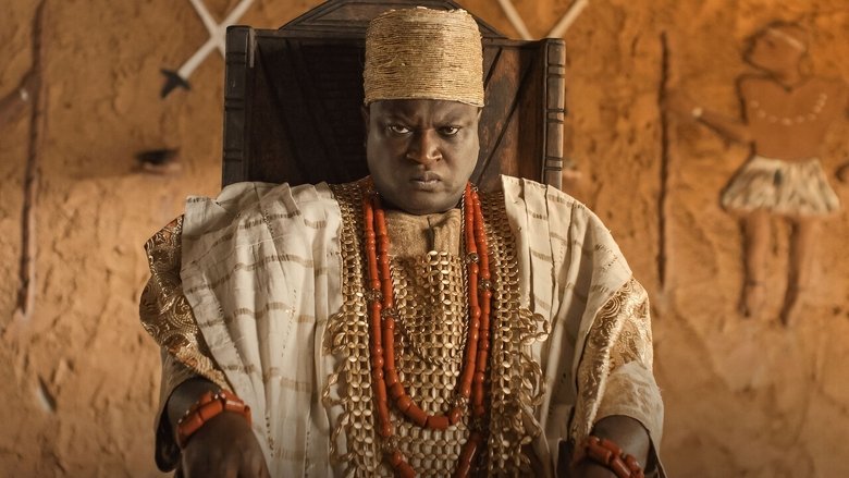 A dimly lit palace corridor, where Femi Branch as Bashorun Ga’a stands in silhouette, his beaded crown casting long shadows against the mud walls.