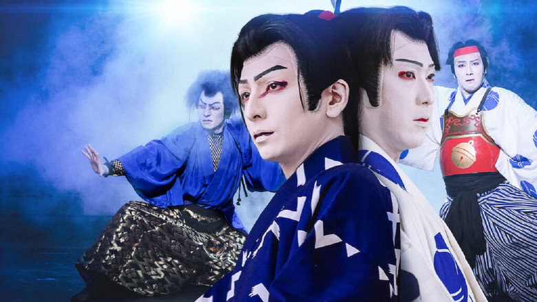 A lone figure in traditional kabuki makeup and costume stands on an empty stage, bathed in the soft glow of stage lights, their posture rigid with concentration.