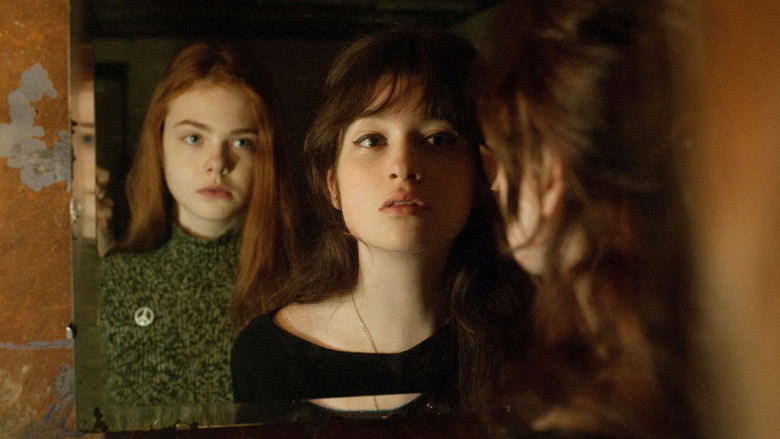 The titular Ginger and Rosa walking on the beach, bathed in soft, period-appropriate light