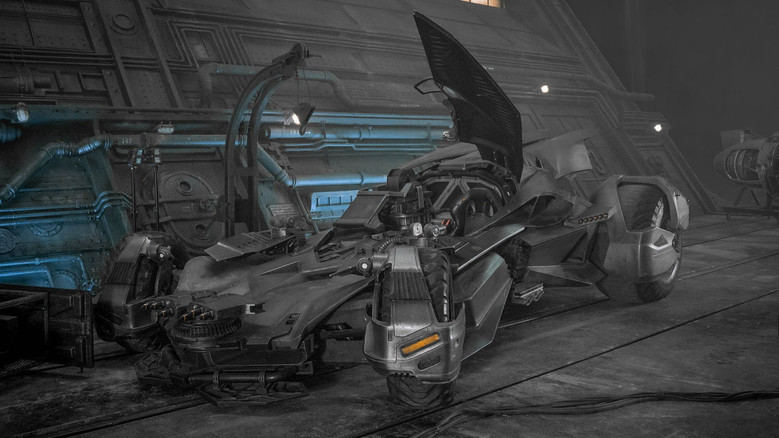 Wonder Woman leaps into action with her shield raised