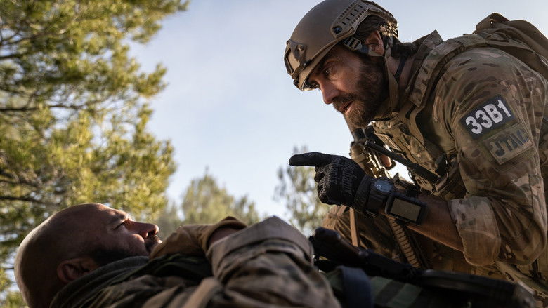 Kinley holding a weapon in a tense standoff