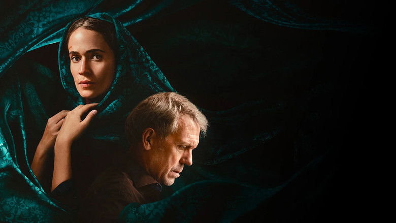 Faraz standing alone in a dimly lit office