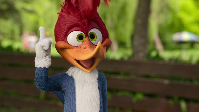 Woody Woodpecker mid-chaos, his beak buried in a live-action campfire log while a group of wide-eyed kids watches in horror