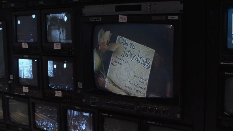The Folksmen looking over their instruments and sheet music