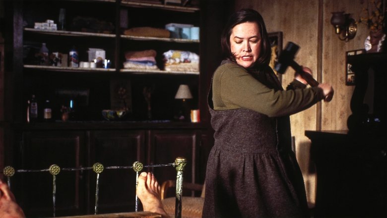 Annie Wilkes standing over a bedridden Paul Sheldon with a tray of food