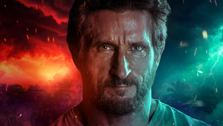 A contestant sitting alone at dawn, looking out over the ocean, reflecting on their position in the game.