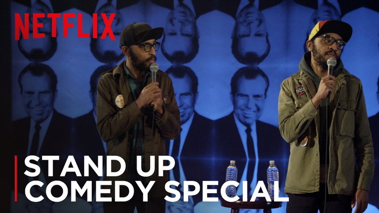 The Lucas Brothers on stage, mid-joke, their faces expressionless as the audience laughs around them.