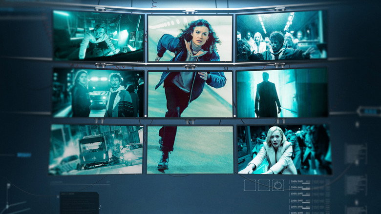 A tense confrontation in a dimly lit server room, screens casting eerie blue light on the characters' faces