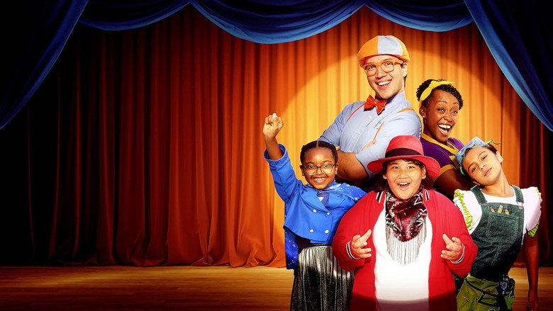 Blippi and Meekah setting up the talent show stage, fairy lights glowing in the background