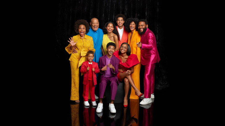 The Johnsons gathered around the dinner table, laughing, with Dre mid-monologue