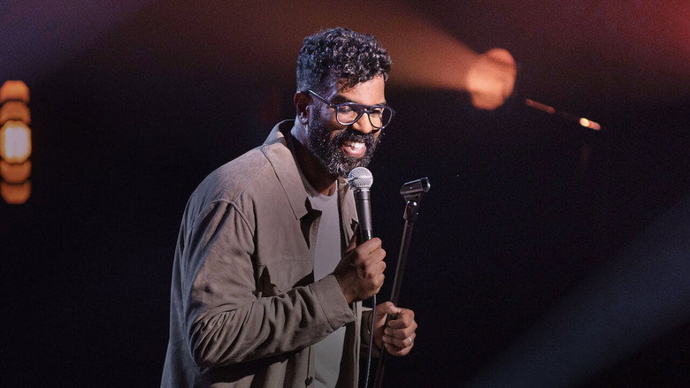 A dimly lit stage, Ranganathan mid-monologue, his expression a mix of exhaustion and amusement