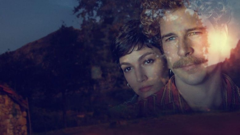 The weathered facade of the family estate, looming over the landscape like a memory.