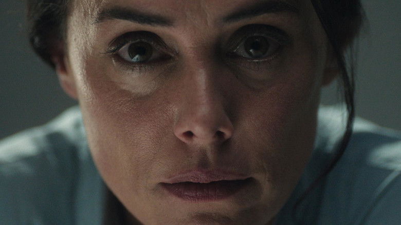 Diana looks across the lake house living room