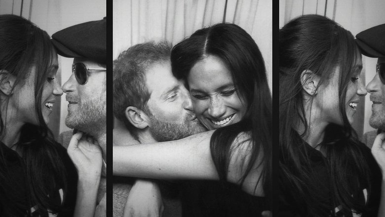 A dimly lit interview scene, Harry and Meghan seated close together, their expressions a mix of resolve and exhaustion