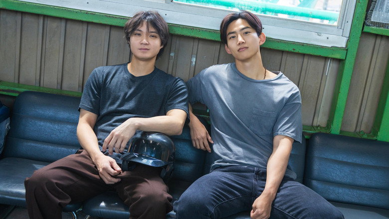 Ryu and Johan in a dimly lit kitchen, the steam from their coffee cups curling between them