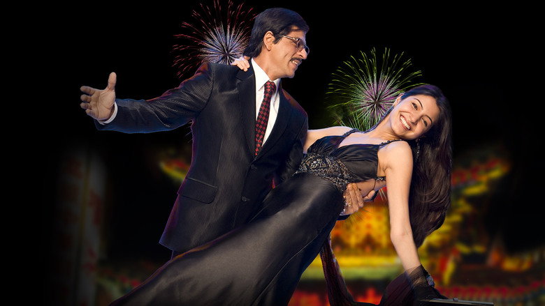Shah Rukh Khan as Raj, mid-dance, his arms outstretched in a moment of uninhibited joy