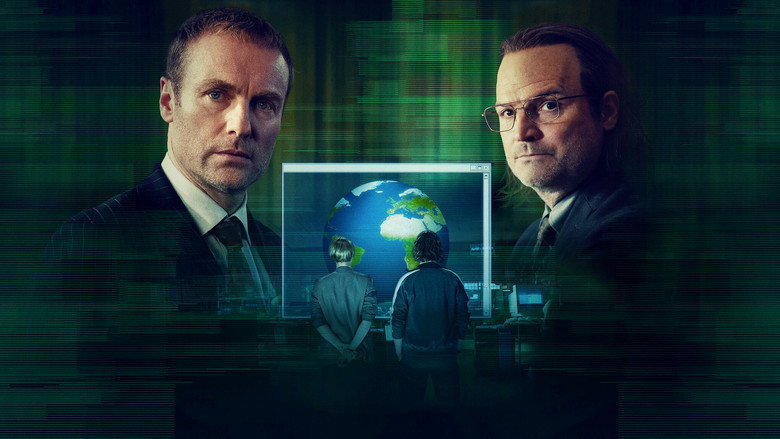 A dimly lit room where two young men stand before a projection of a 3D globe, their faces lit with the glow of their creation