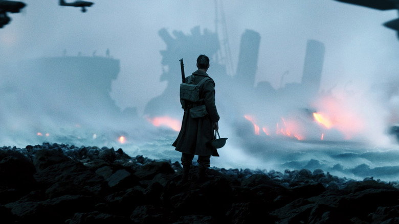 Soldiers waiting in lines on the sandy beach of Dunkirk, looking out to sea