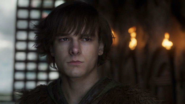 Hiccup tentatively reaching out to touch the dragon Toothless