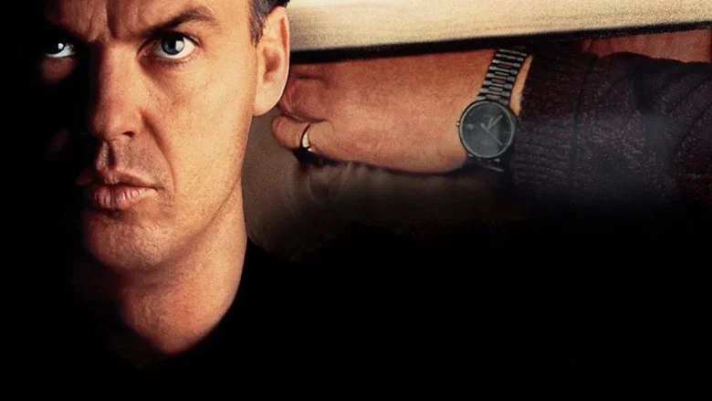 A tense moment in the Victorian house, with Melanie Griffith and Matthew Modine standing at the top of a staircase, looking down in alarm