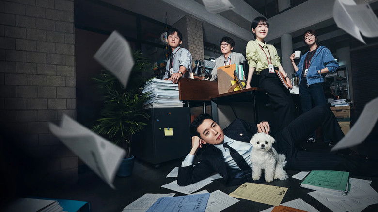 Kang Da-wit looking pensive in a dimly lit office