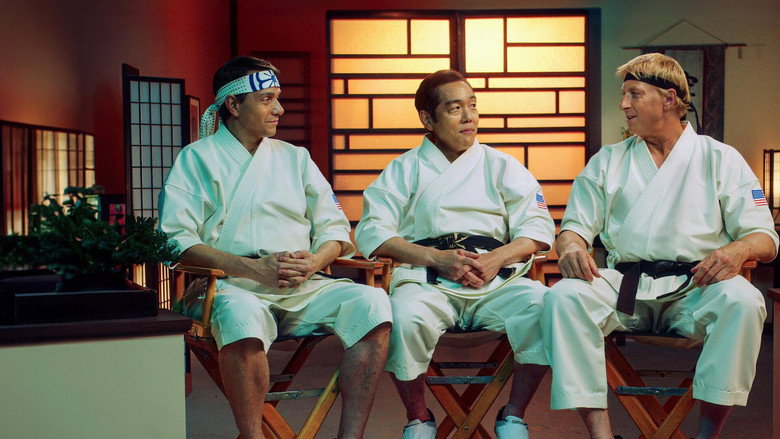 The cast of *Cobra Kai* gathered in a dojo, laughing between takes, their faces lit with the warm glow of shared history.