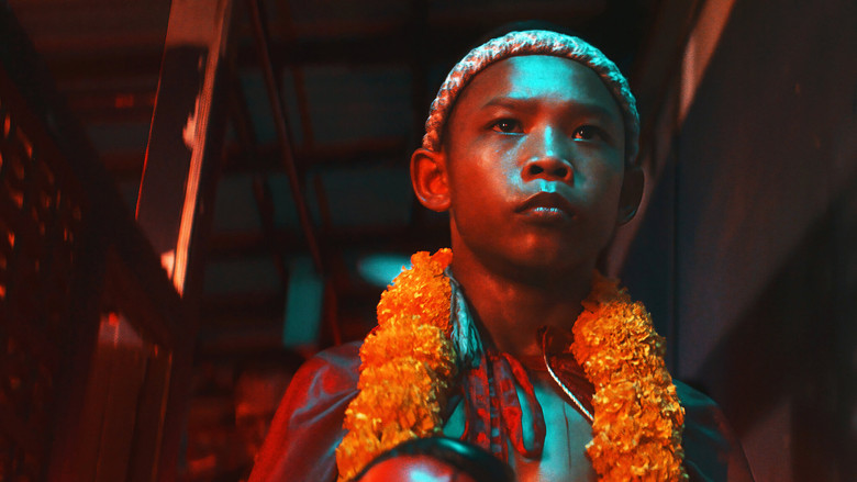 A fighter’s face, half-lit by harsh stadium lights, sweat and blood streaking down his cheek