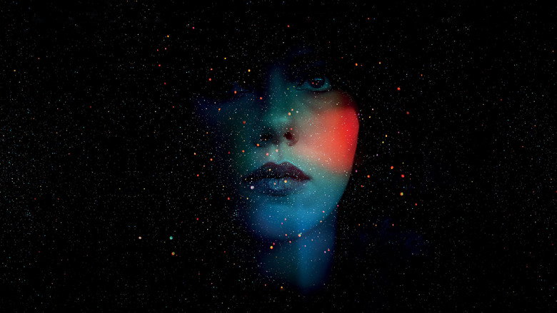 Johansson’s alien examines her human form in a dimly lit room, her reflection warped by the mirror’s imperfections.