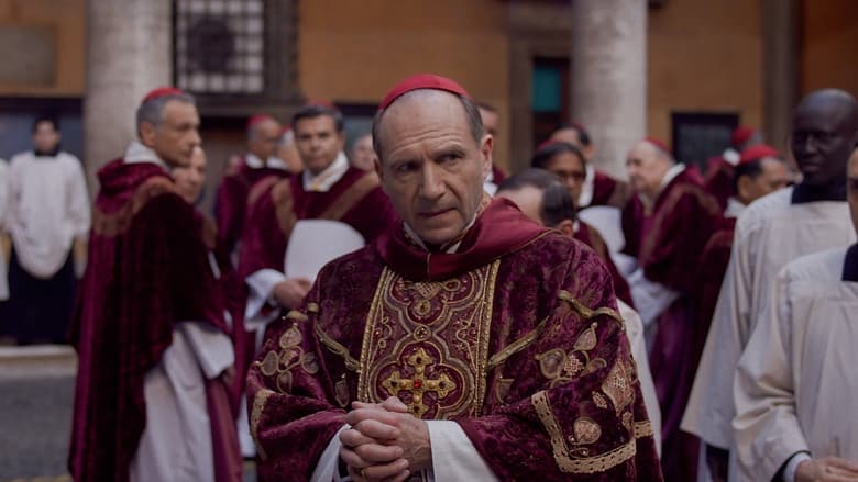 Cardinal Lawrence stands in the dimly lit, ornate corridors of the Vatican, looking burdened and contemplative.