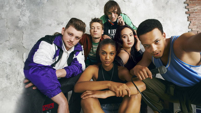 A dimly lit basement, walls covered in graffiti, a group of young men huddled around a turntable, their faces half-lit by a single bulb