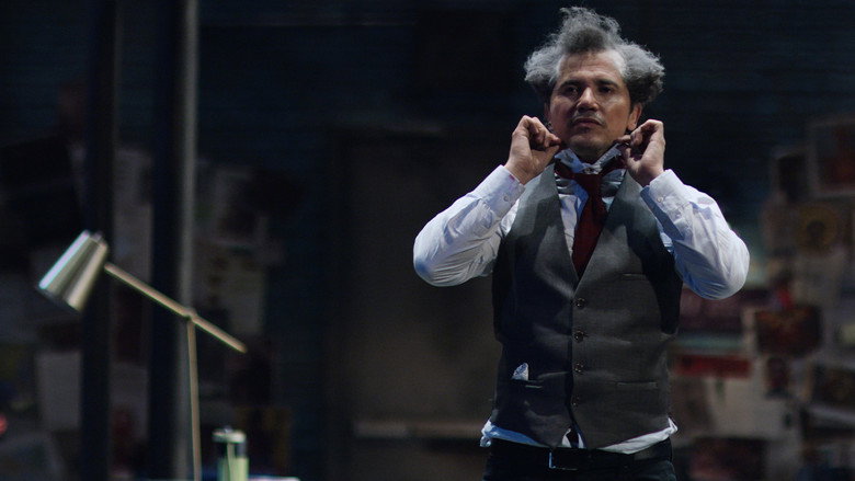 Leguizamo mid-monologue, arms outstretched, as if pleading with an invisible classroom