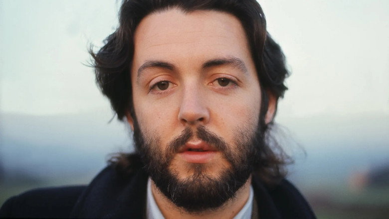 Candid archival footage showing Paul and Linda McCartney sharing a quiet, intimate moment, highlighting the domestic partnership that grounded his post-Beatles life