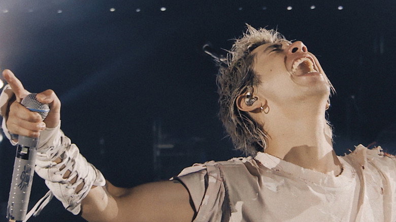 The band performing to an empty arena, LED walls glowing like a digital void