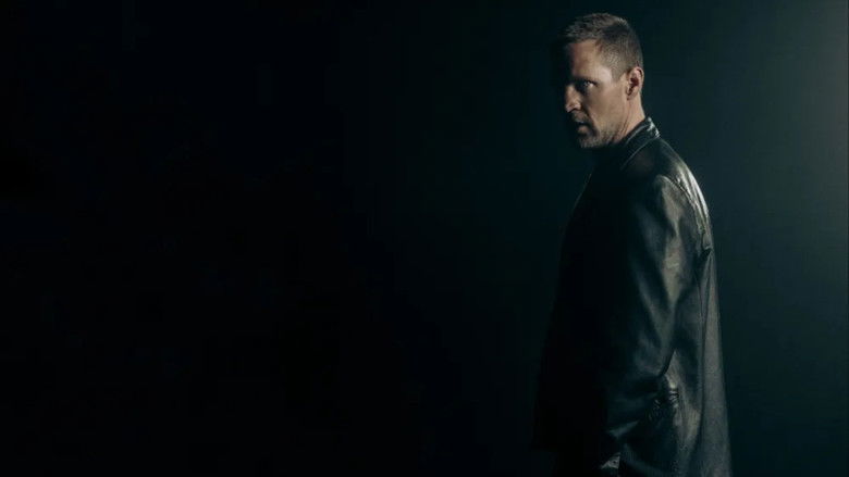 A close-up of a dimly lit, cluttered office, highlighting the oppressive atmosphere