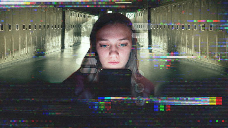 A dimly lit high school hallway, lockers lining the walls, the camera positioned as if someone is watching from the shadows.