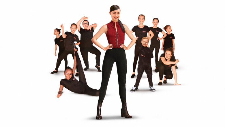 April and the young dancers mid-routine, their faces alight with effort and joy