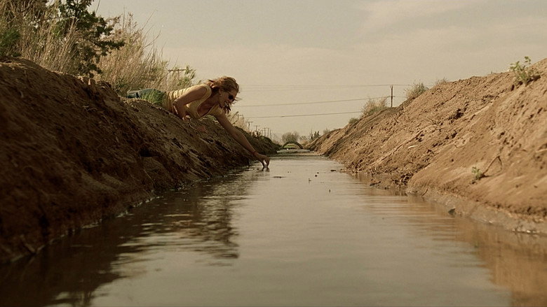 Erin standing with a file, looking confrontational